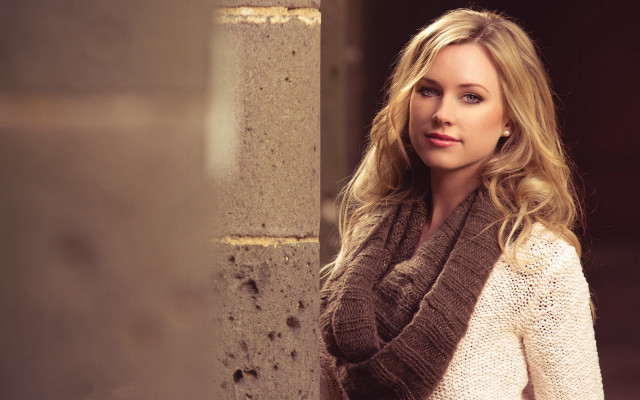 Woman leaning wall scarf sweater free wallpaper for desktop - medium preview image