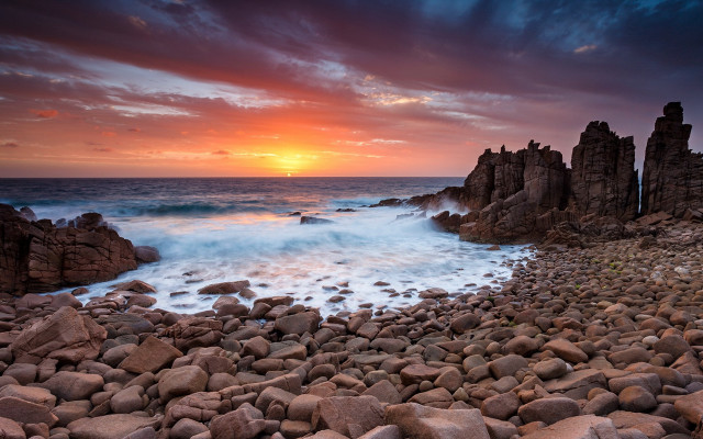 Rocky beach wave sunset cityscape free wallpaper for desktop - medium preview image