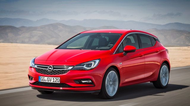 Red opel mountains cloudy road free wallpaper for desktop - medium preview image