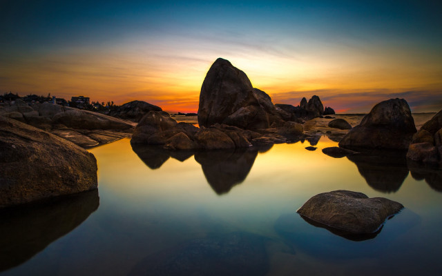 Sunset water rocks building sky free wallpaper for desktop - medium preview image