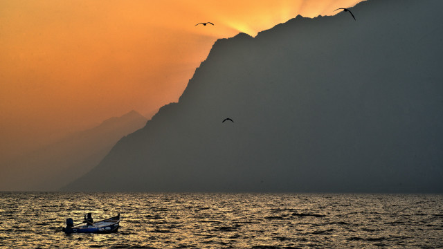 Boat birds sunset mountain ocean free wallpaper for desktop - medium preview image