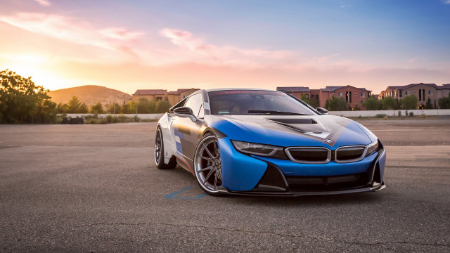 Blue sports car sunset city free wallpaper for desktop - medium preview image