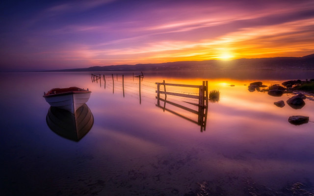 Boat sunset fence water mountain free wallpaper for desktop - medium preview image