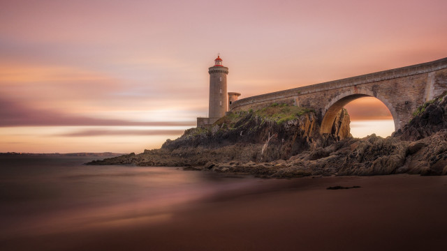 Lighthouse rocky cliff bridge sunset free wallpaper for desktop - medium preview image