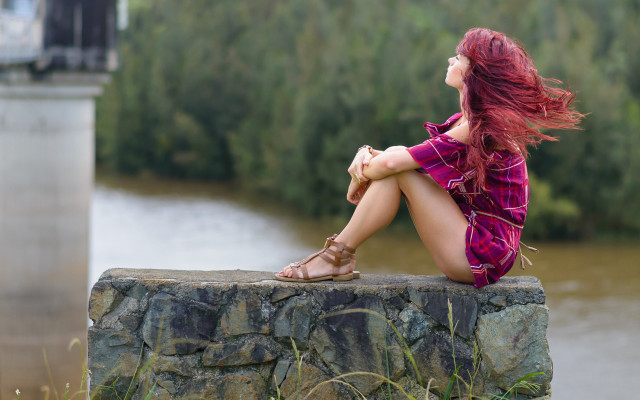 Woman redhair sitting rock river free wallpaper for desktop - medium preview image
