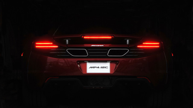 Red sports car dark tail free wallpaper for desktop - medium preview image