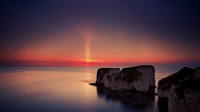 Sunset ocean rocks bright sun free wallpaper for desktop - medium preview image