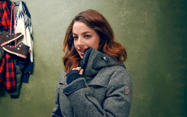 Woman talking cellphone coat wall free wallpaper for desktop - medium preview image