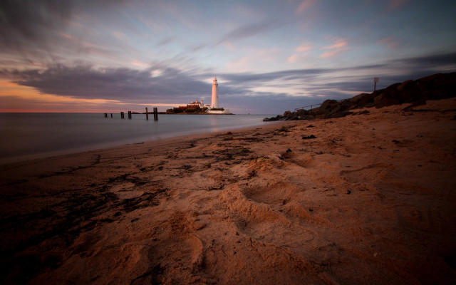 Lighthouse beach cloudy sunset horizon free wallpaper for desktop - medium preview image
