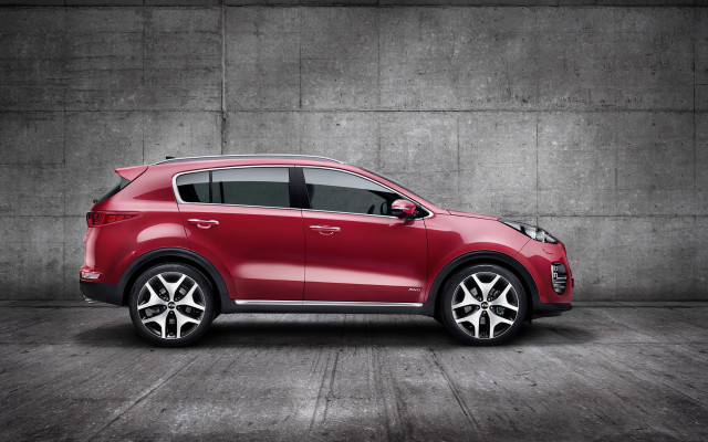 Red car concrete wall pavement free wallpaper for desktop - medium preview image