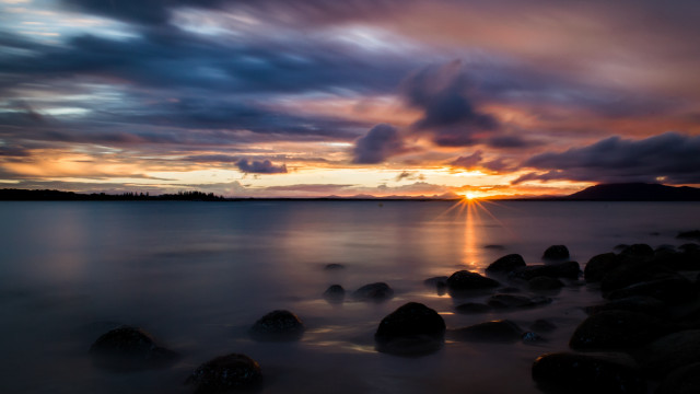 Sunset water rocks mountain clouds free wallpaper for desktop - medium preview image