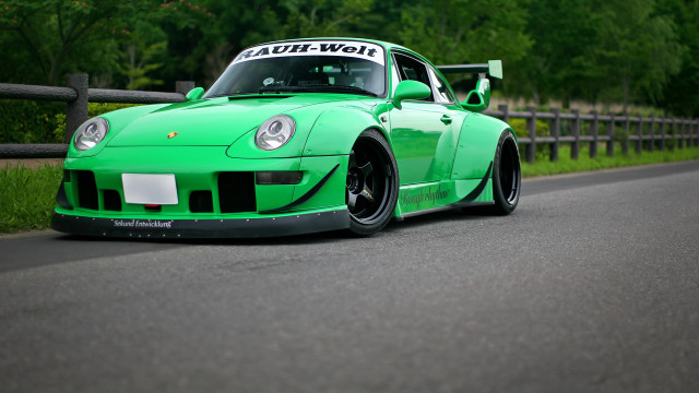 Green sports car driving road free wallpaper for desktop - medium preview image