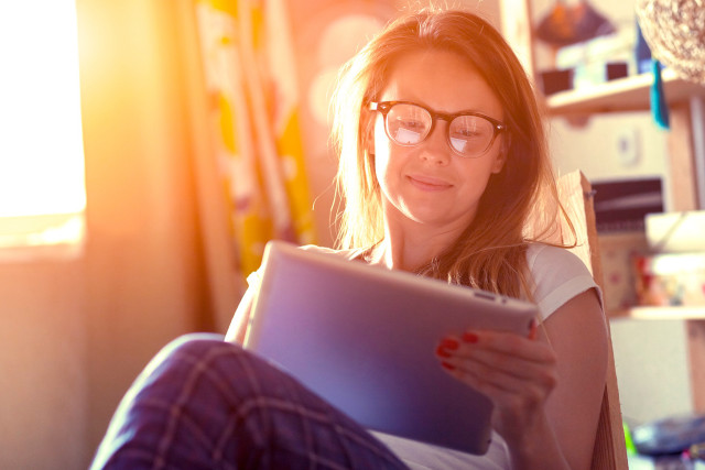 Woman glasses tablet couch window free wallpaper for desktop - medium preview image