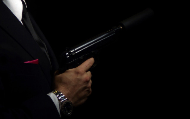 Man suit gun watch redtie free wallpaper for desktop - medium preview image
