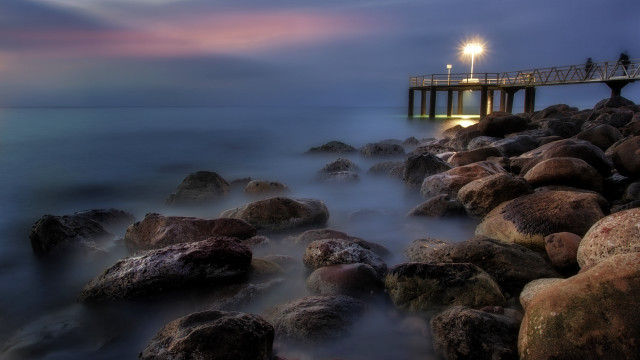 Rocky beach pier night mystical free wallpaper for desktop - medium preview image