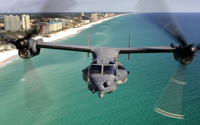 Military plane beach ocean buildings free wallpaper for desktop - medium preview image