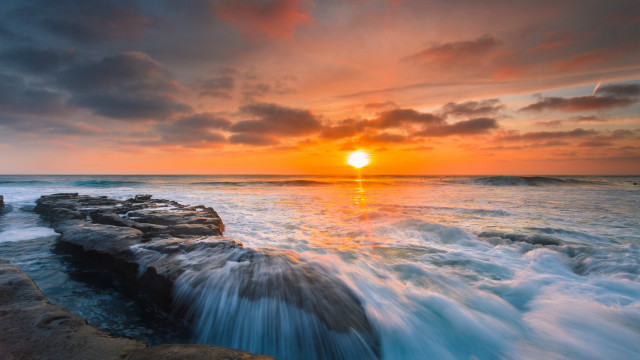 Sunset ocean waves rocks person free wallpaper for desktop - medium preview image