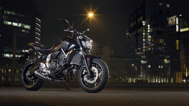 Motorcycle city night streetlight buildings free wallpaper for desktop - medium preview image