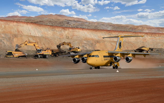 Yellow plane runway mountain rock free wallpaper for desktop - medium preview image