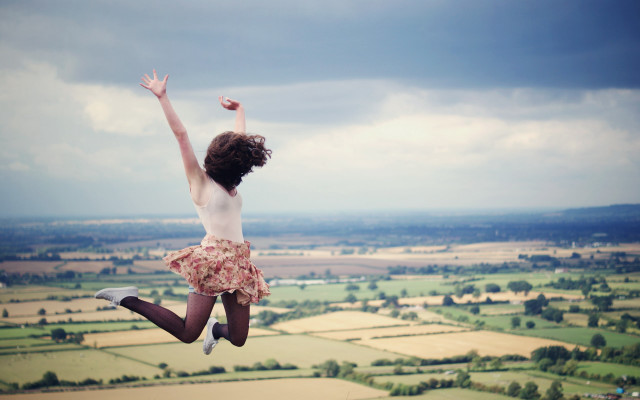 Woman jumping countryside beach sky free wallpaper for desktop - medium preview image