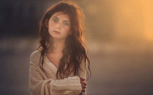 Woman curly hair sweater portrait free wallpaper for desktop - medium preview image