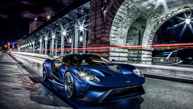 Blue sports car night cityscape free wallpaper for desktop - medium preview image