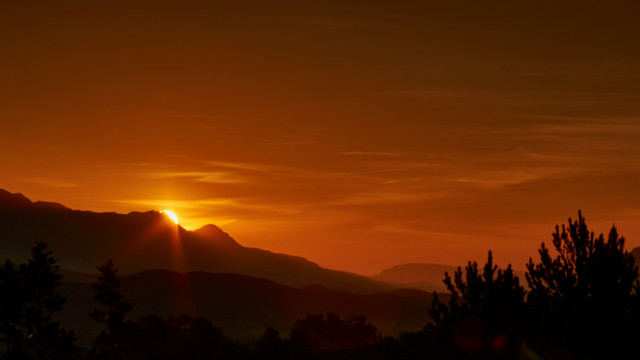 Sunset mountains trees clouds orange free wallpaper for desktop - medium preview image