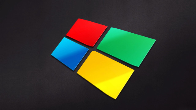 Windows logo closeup black surface free wallpaper for desktop - medium preview image