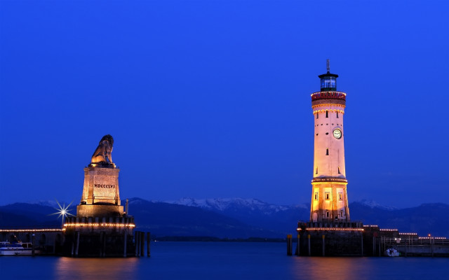Lighthouse night mountains water clock free wallpaper for desktop - medium preview image