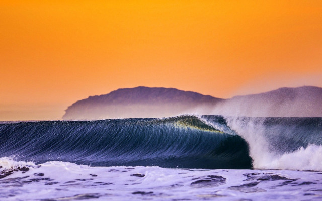 Large wave mountain sunset person free wallpaper for desktop - medium preview image
