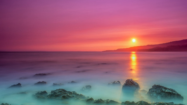 Sunset water rocks mountain mystical free wallpaper for desktop - medium preview image