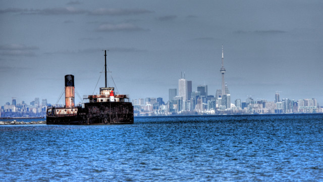Boat cityscape cloudy water skyscraper free wallpaper for desktop - medium preview image