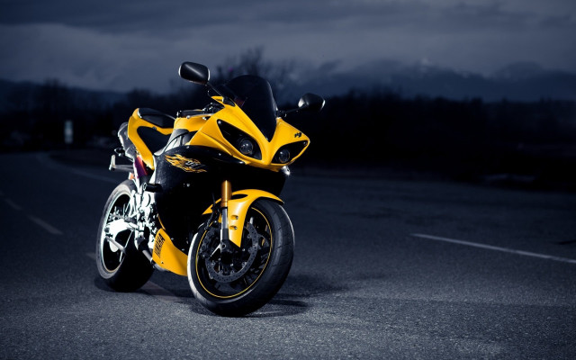 Yellow motorcycle night city lights free wallpaper for desktop - medium preview image
