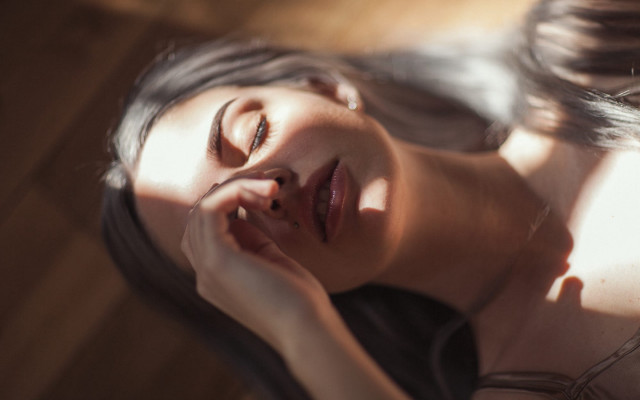 Woman laying down closed eyes free wallpaper for desktop - medium preview image