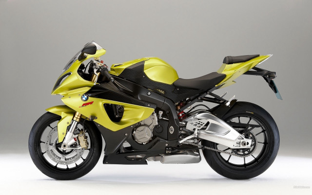 Yellow motorcycle gray wall digital free wallpaper for desktop - medium preview image