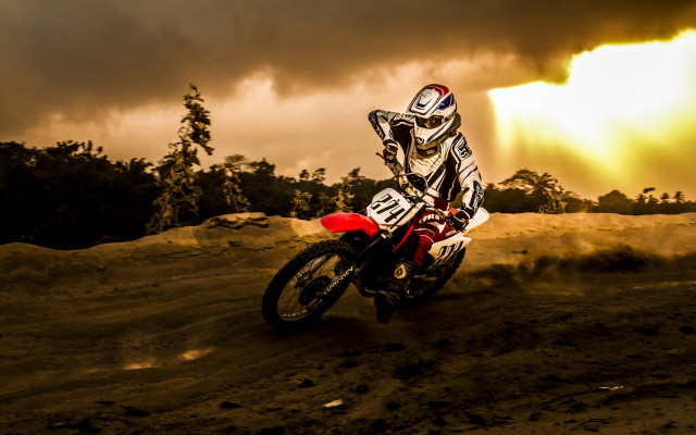 Dirtbike riding cloudy sky trees free wallpaper for desktop - medium preview image