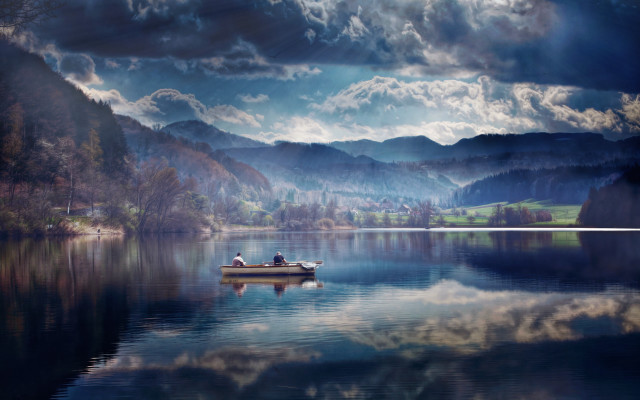 Lake mountains clouds boat person free wallpaper for desktop - medium preview image