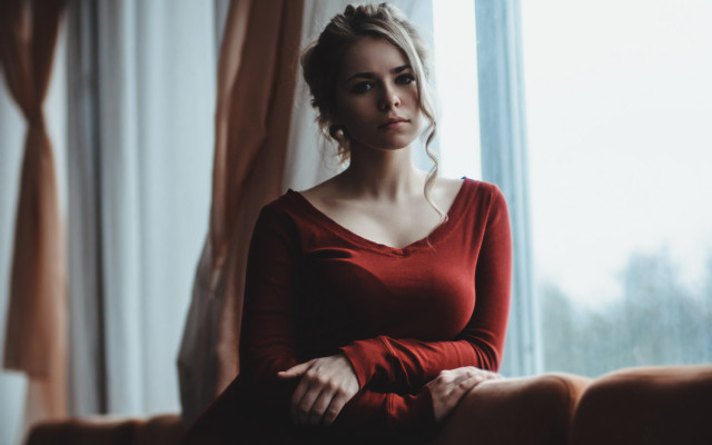 Woman couch window portrait blurry free wallpaper for desktop - medium preview image