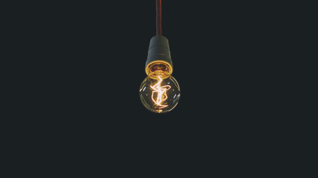 Lightbulb light inside black background free wallpaper for desktop - medium preview image