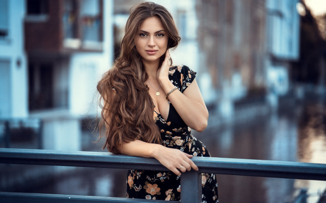 Woman leaning on rail serious #2 free wallpaper for desktop - medium preview image