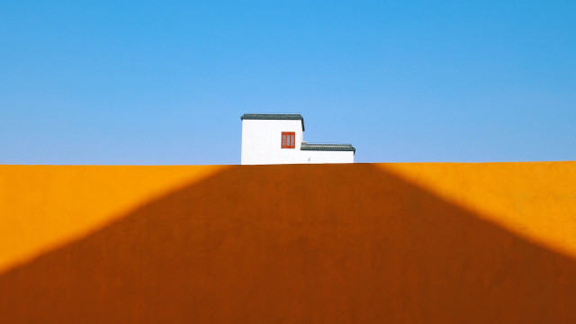 Hill building roof shadow minimalist free wallpaper for desktop - medium preview image