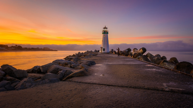 Lighthouse pier sunset clouds water free wallpaper for desktop - medium preview image