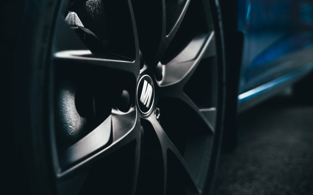 Car tire closeup blue background free wallpaper for desktop - medium preview image