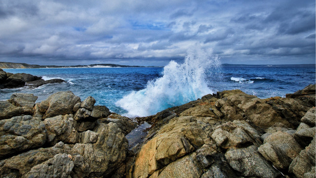 Wave rocks ocean cloudy sky free wallpaper for desktop - medium preview image