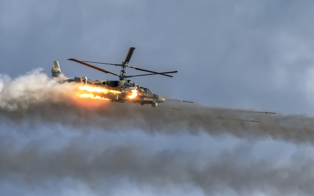 Helicopter smoke landinggear clouds mountains free wallpaper for desktop - medium preview image