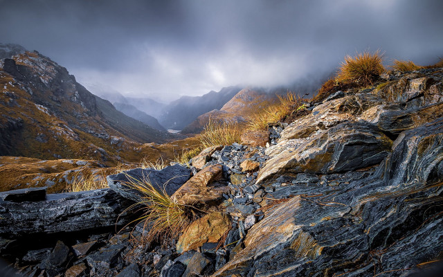 Rocky mountain grass cloudy sky free wallpaper for desktop - medium preview image