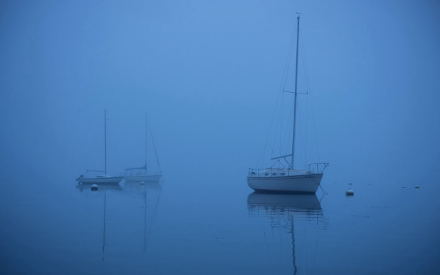 Boats foggy ocean blue sky free wallpaper for desktop - medium preview image