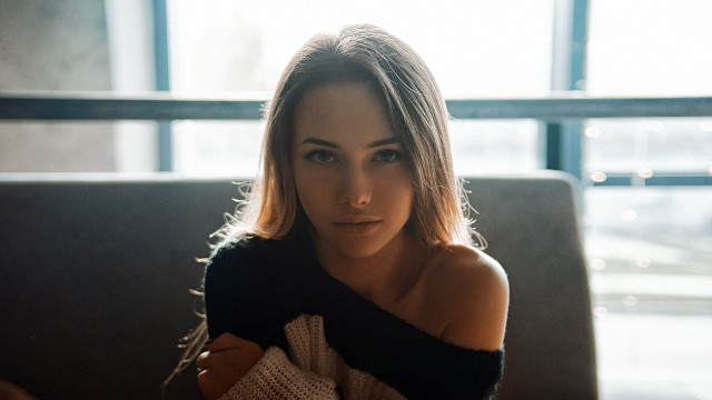 Woman couch sweater portrait blonde free wallpaper for desktop - medium preview image