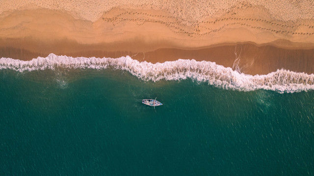 Boat beach waves sand cinematic free wallpaper for desktop - medium preview image