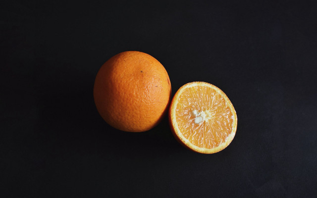 Two oranges halved minimalist stilllife free wallpaper for desktop - medium preview image